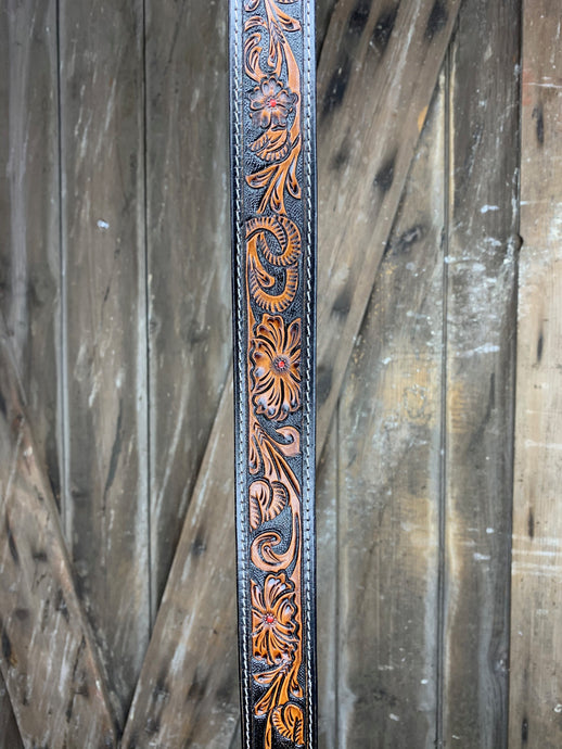 Hand tooled leather purse or bag strap.